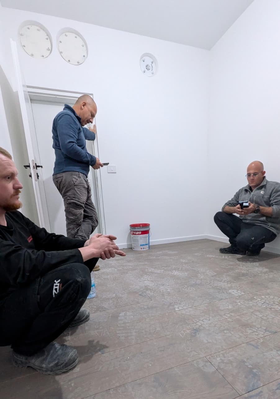 Stas and the plasterers in the shelter